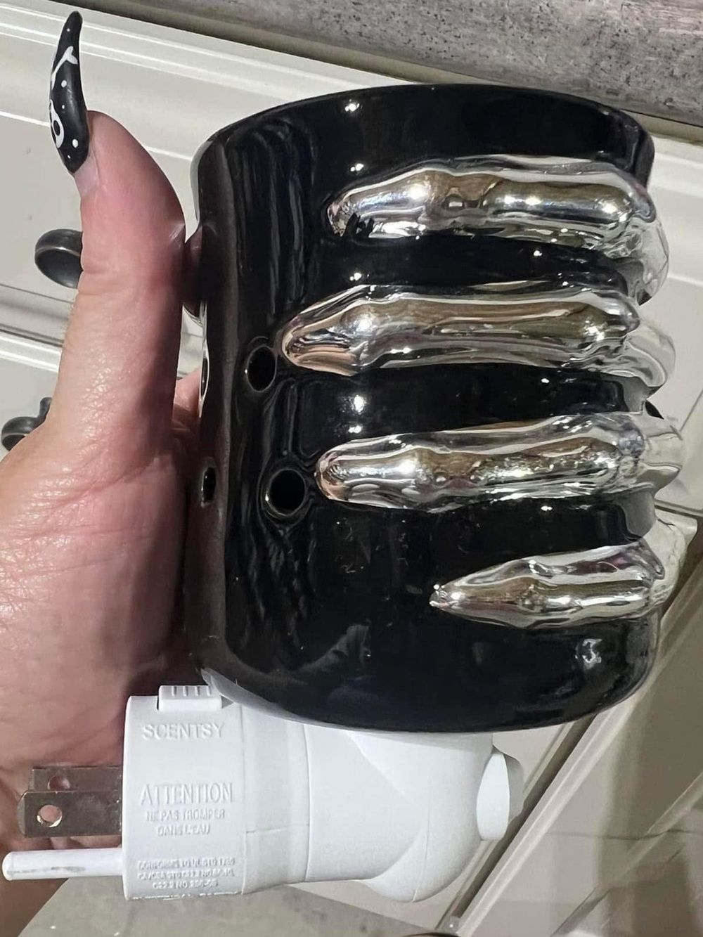 Scentsy Black Ceramic Plug-In Warmer with Silver Skelton hand Accents